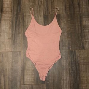 Baby pink body suit